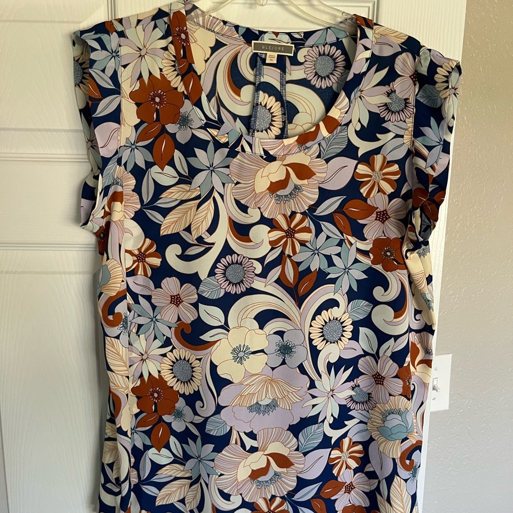 Sleeveless blouse, office wear.